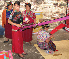 Modern (standing) and traditional (kneeling) back strap weaving